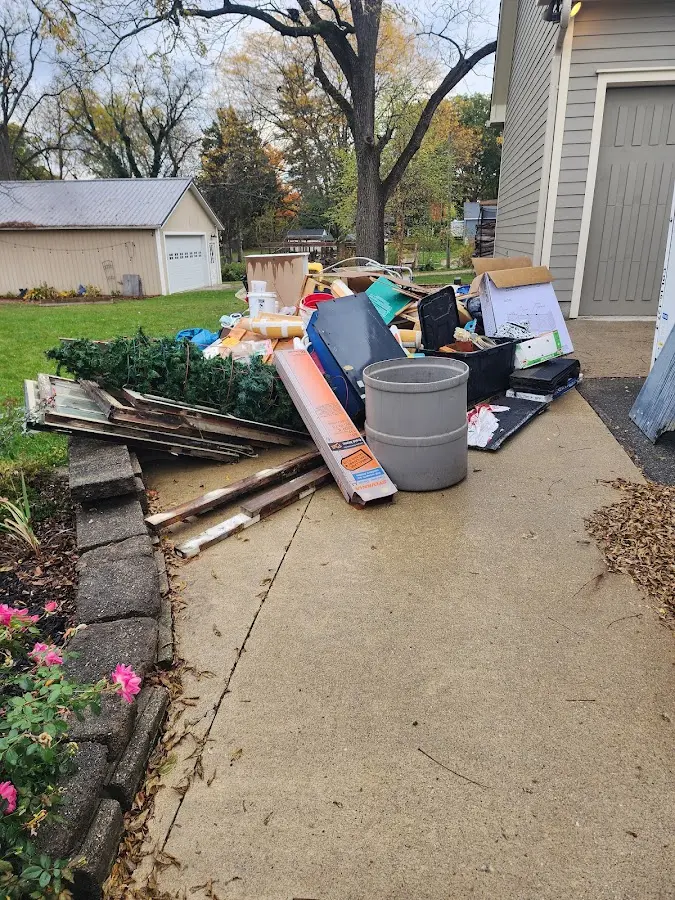 Dumpster being loaded with debris for Residential Dumpster Rental in Campton